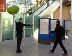 Street marketing operation with a backpack balloon: flyer distribution