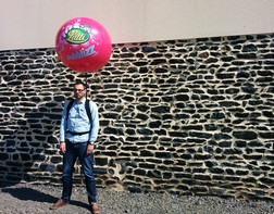 Giant balloon on a backpack for a Lutti product launch