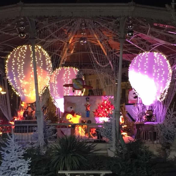 4 decorative hot-air balloons suspended and inflated in the air for the Cannes Christmas Market 